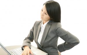 Tired young Asian business woman