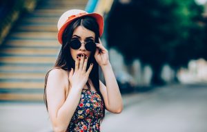 beautiful girl poses for camera in the city