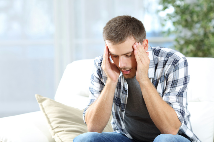 Man suffering headache at home