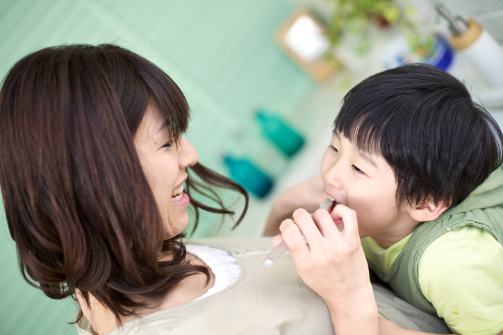 Japanese Mother and Son Brushing Teeth