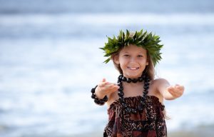 Pretty Girl smiling and dancing the Hula