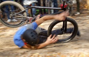 Man falling Off BMX Bike on Track