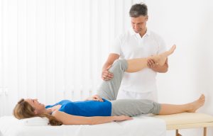Woman Receiving Leg Massage In Spa