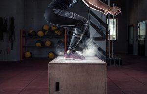 Box jump workout at gym gym closeup